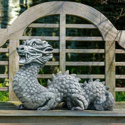 Campania International Festival Dragon Statue, set in the garden to adding charm an meaning. The statue is shown in the Alpine Stone Patina.