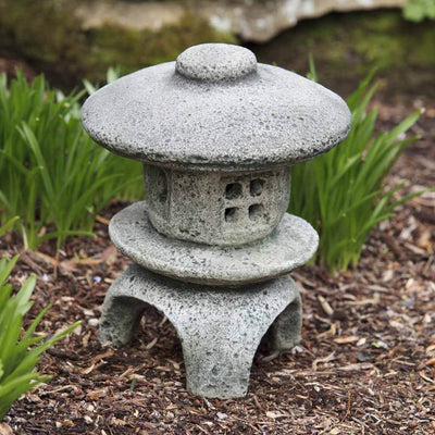 Campania International Mini Pagoda, set in the garden to adding charm an meaning. The statue is shown in the Alpine Stone Patina.