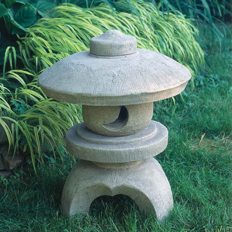 Campania International Morris Round Pagoda, set in the garden to adding charm an meaning. The statue is shown in the Verde Patina.