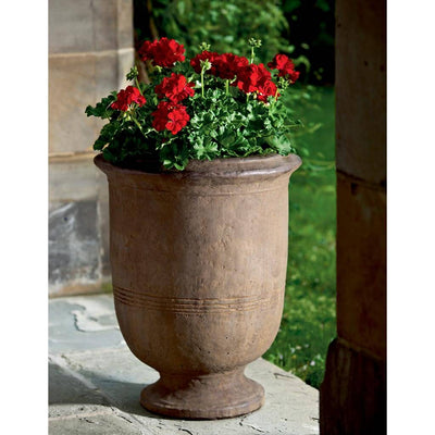 Campania International Provencal Large Urn is shown in the Pietra Nuovo Patina. Made from cast stone.