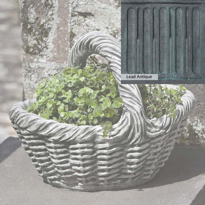 The Lead Antique Patina for the Campania International Basket with Handle Small Planter, aged blue and grey layered to give the look of a classic antique lead patina.