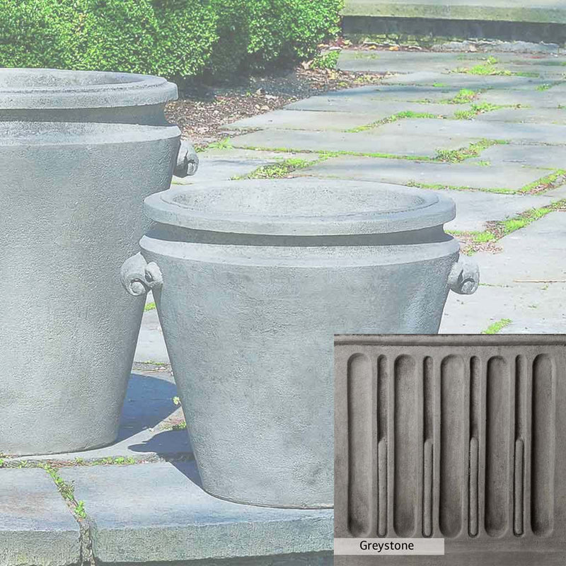 Greystone Patina for the Campania International Scroll Handle Medium Planter , a classic gray, soft, and muted, blends nicely in the garden.