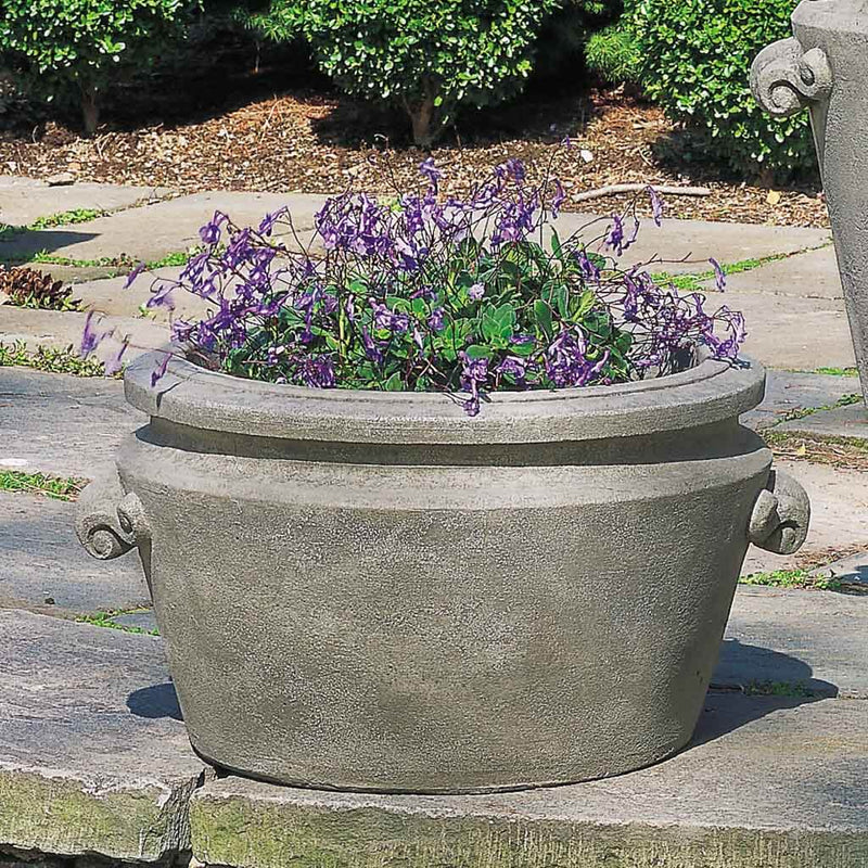 Campania International Scroll Handle Tub Planter is shown in the Greystone Patina. Made from cast stone.