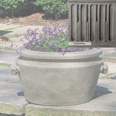 Greystone Patina for the Campania International Scroll Handle Tub Planter , a classic gray, soft, and muted, blends nicely in the garden.