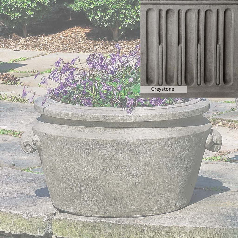 Greystone Patina for the Campania International Scroll Handle Tub Planter , a classic gray, soft, and muted, blends nicely in the garden.