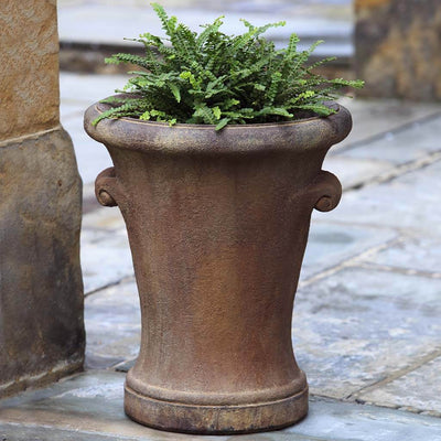 Campania International Monterey Planter is shown in the Pietra Nuova Patina. Made from cast stone.