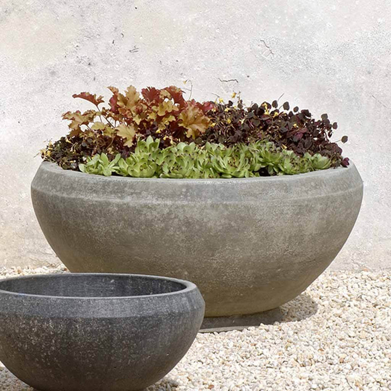 Campania International Giulia Large Planter is shown in the Greystone Patina. Made from cast stone.