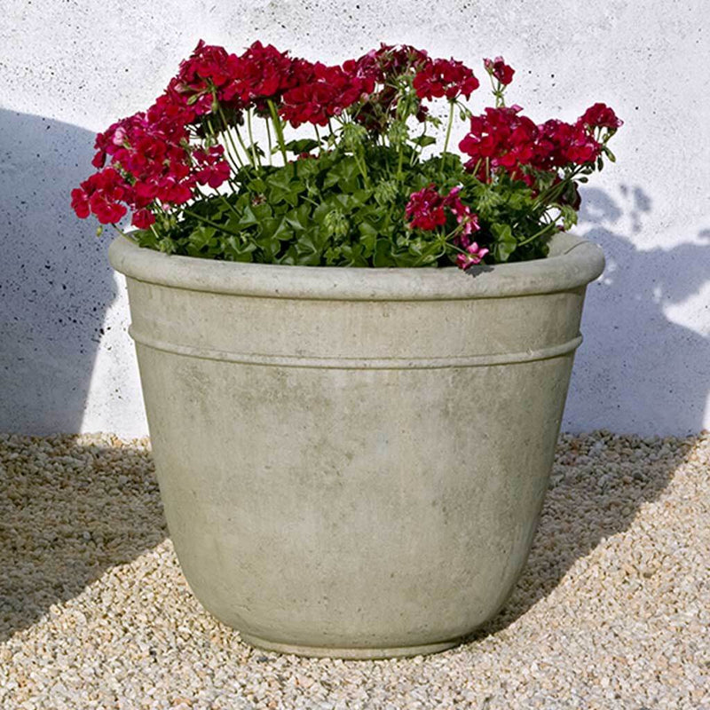 Campania International Carema Medium Planter is shown in the Verde Patina. Made from cast stone.