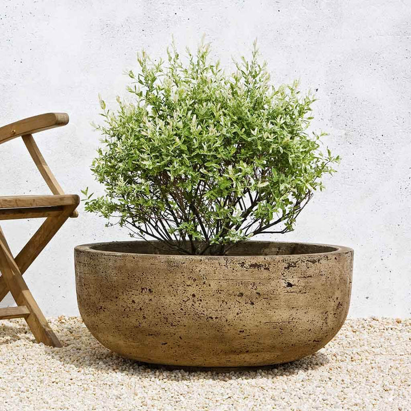 Campania International Mesa Large Planter is shown in the Brownstone Patina. Made from cast stone.