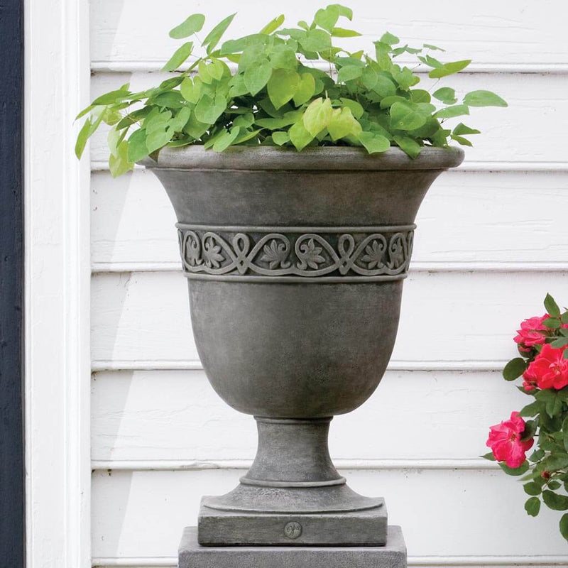 Campania International Williamsburg Strapwork Leaf Urn is shown in the Alpine Stone Patina. Made from cast stone.