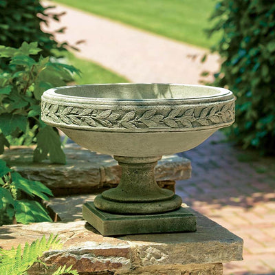  Campania International Longwood Laurel Banded Urn is shown in the Alpine Stone Patina. Made from cast stone.