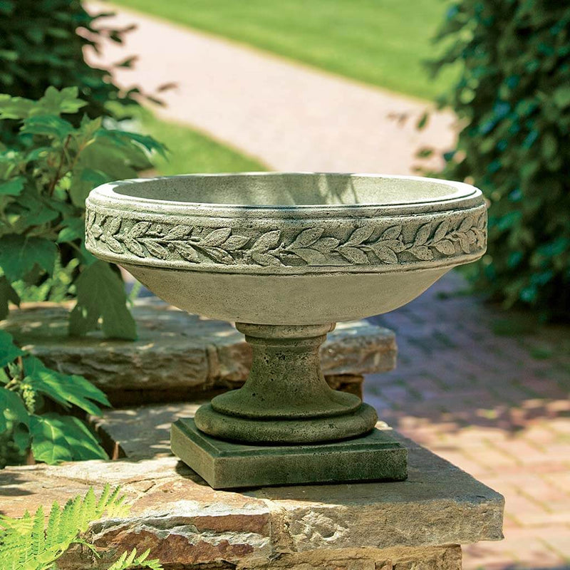 Campania International Longwood Laurel Banded Urn is shown in the Alpine Stone Patina. Made from cast stone.