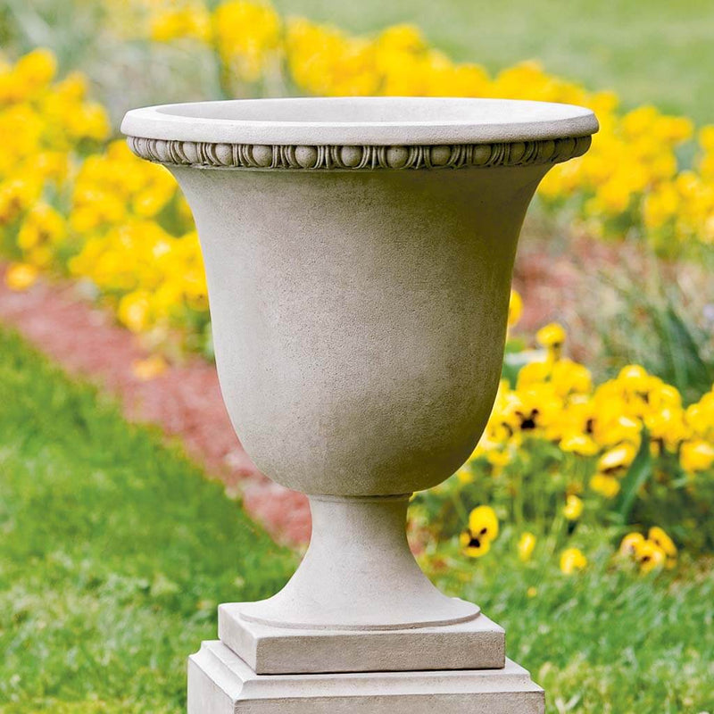 Campania International Williamsburg Egg and Dart Urn is shown in the Verde Patina. Made from cast stone.