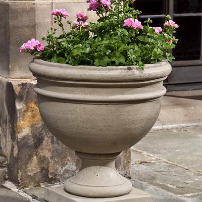  Campania International Montgomery Urn is shown in the Verde Patina. Made from cast stone.
