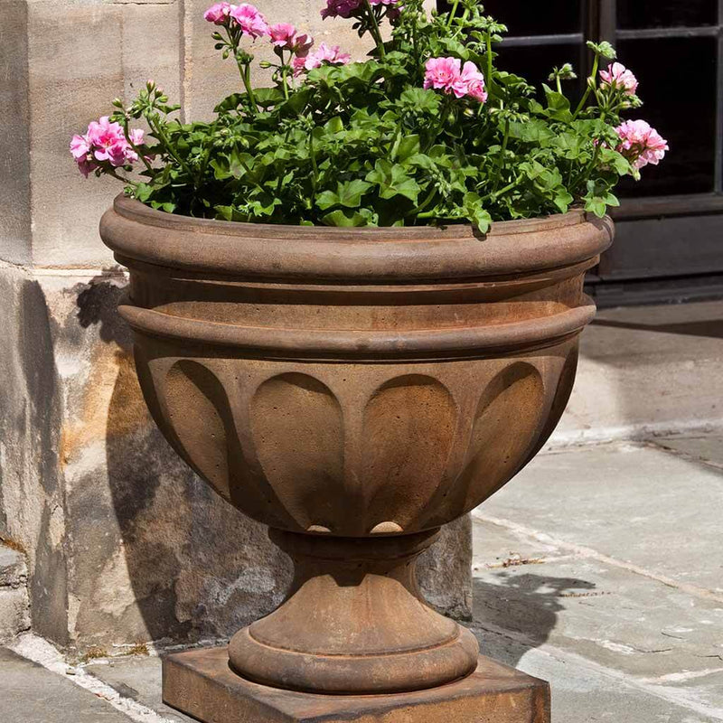 Campania International Augusta Urn is shown in the Pietra Nuovo Patina. Made from cast stone.