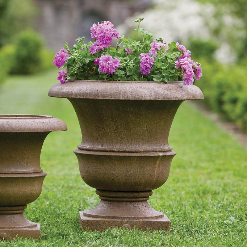  Campania International Williamsburg Wren Large Planter is shown in the Age Limestone Patina. Made from cast stone.