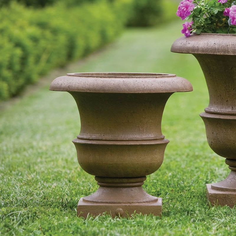 Campania International Williamsburg Wren Small Planter is shown in the Aged Limestone Patina. Made from cast stone.