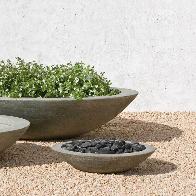 Campania International Low Zen Small Bowl is shown in the Alpine Stone Patina. Made from cast stone.