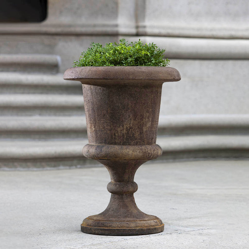  Campania International Smithsonian Goblet Urn is shown in the Pietra Nuovo Patina. Made from cast stone.