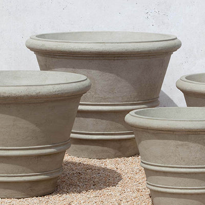 Campania International Classic Rolled Rim 35.5 inch Planter is shown in the Verde Patina. Made from cast stone.