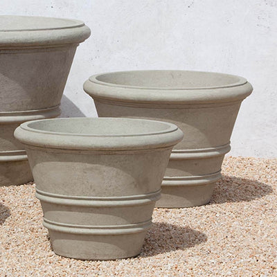 Campania International Classic Rolled Rim 27-inch Planter is shown in the Verde Patina. Made from cast stone.