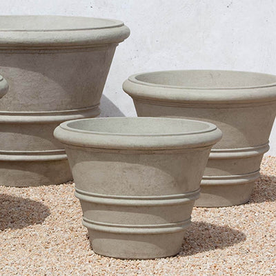 Campania International Classic Rolled Rim 24-inch Planter is shown in the Verde Patina. Made from cast stone.