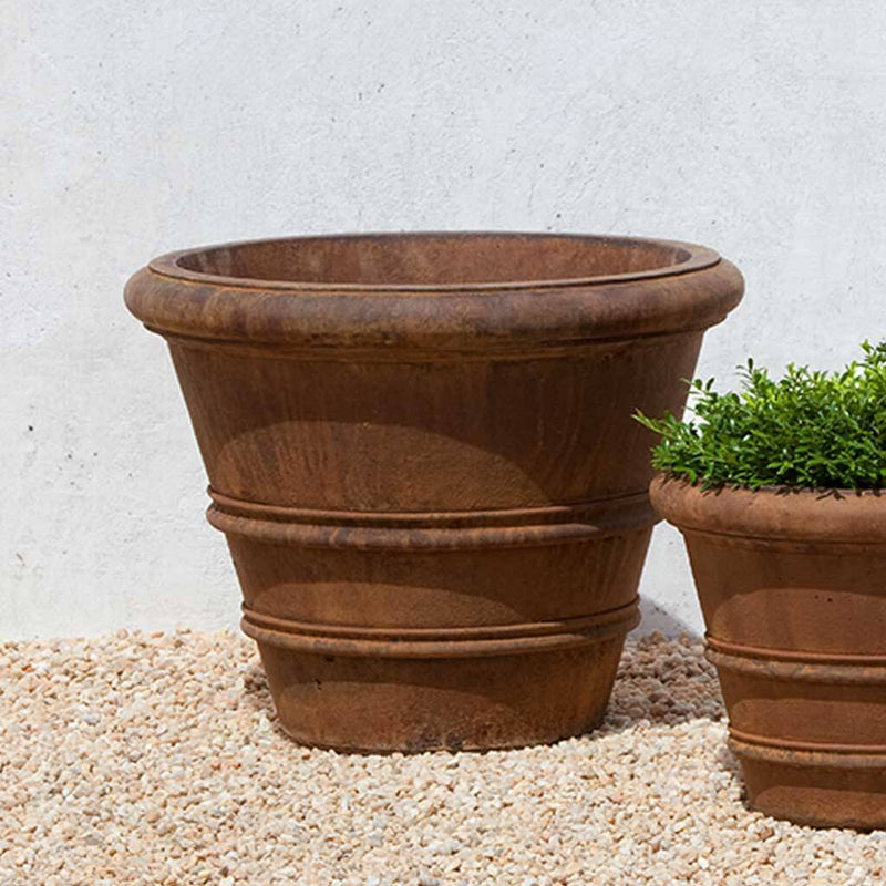 Campania International Classic Rolled Rim 20.75-inch Planter is shown in the Ferro Rustico Nuovo Patina. Made from cast stone.