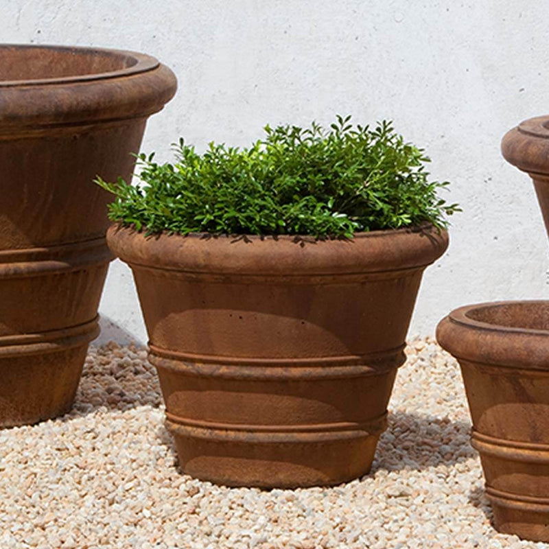 Campania International Classic Rolled Rim 14.75-inch Planter is shown in the Ferro Rustico Nuovo Patina. Made from cast stone.