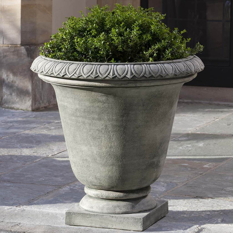 Campania International Millbridge Urn is shown in the Greystone Patina. Made from cast stone.