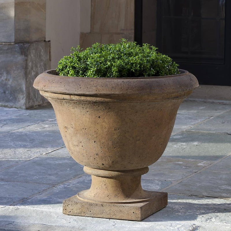  Campania International Rustic Greenwich Urn is shown in the Pietra Nuovo Patina. Made from cast stone.