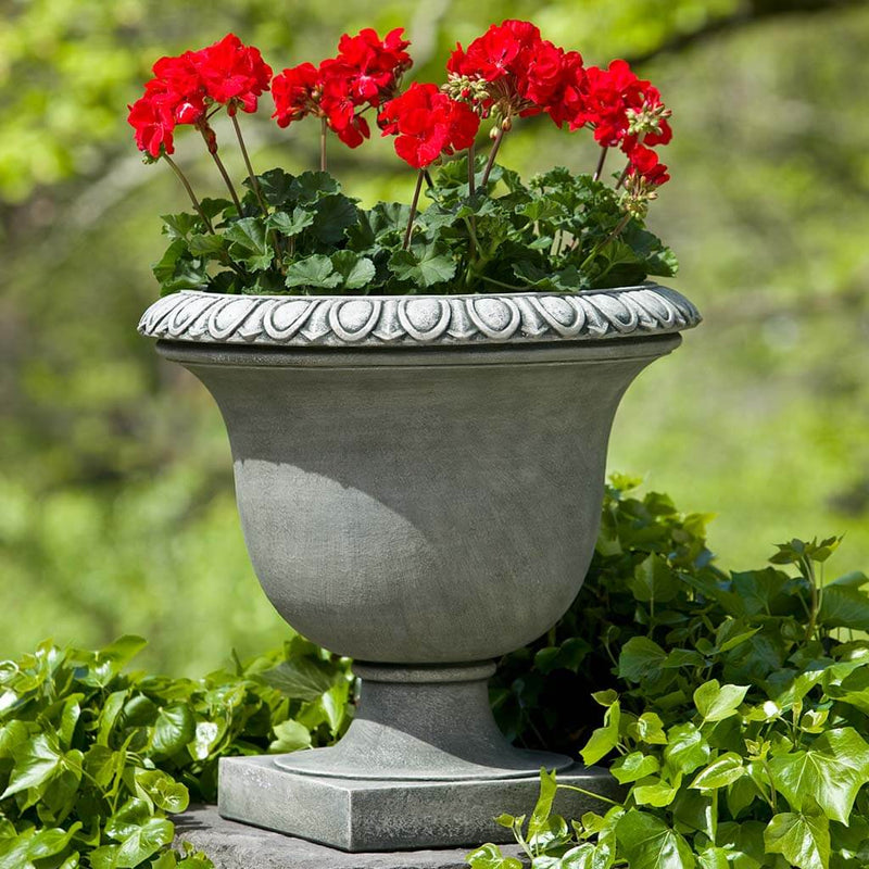 Campania International Litchfield Egg and Dart Urn is shown in the Alpine Stone Patina. Made from cast stone.
