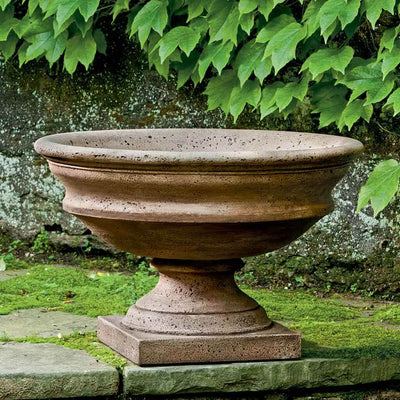 Campania International Newberry Urn is shown in the Pietra Nuovo Patina. Made from cast stone.