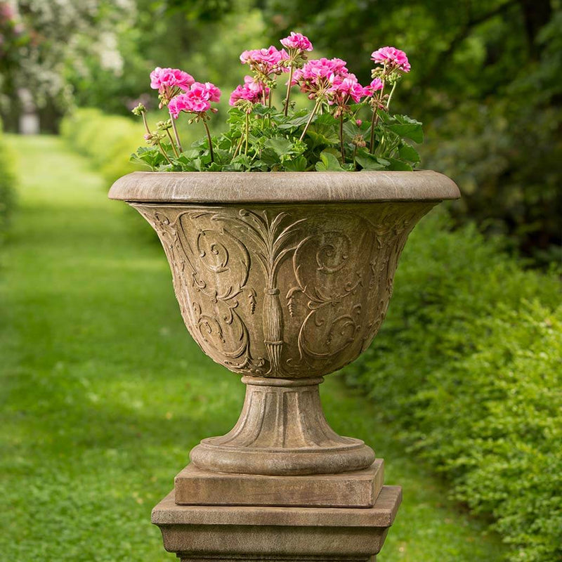 Campania International Palais Arabesque Urn is shown in the Age Limestone Patina. Made from cast stone.