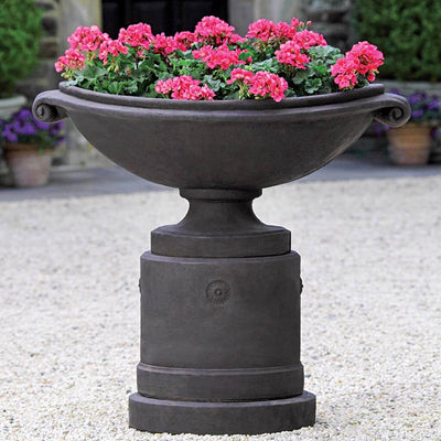 Campania International Medici Planter with Pedestal is shown in the Nero Nuovo Patina. Made from cast stone.