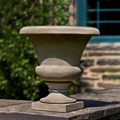 Campania International Mt. Airy Urn is shown in the Verde Patina. Made from cast stone.
