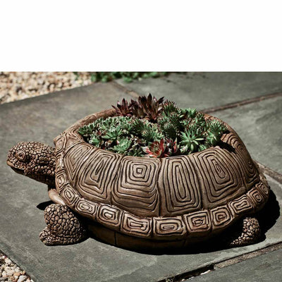 Campania International Turtle Planter is shown in the Brownstone Patina. Made from cast stone.