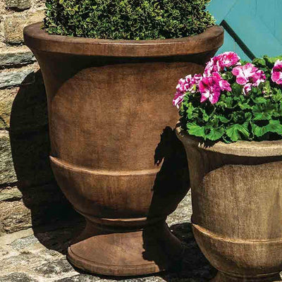 Campania International Pascal Large Urn is shown in the Pietra Nuovo Patina. Made from cast stone.