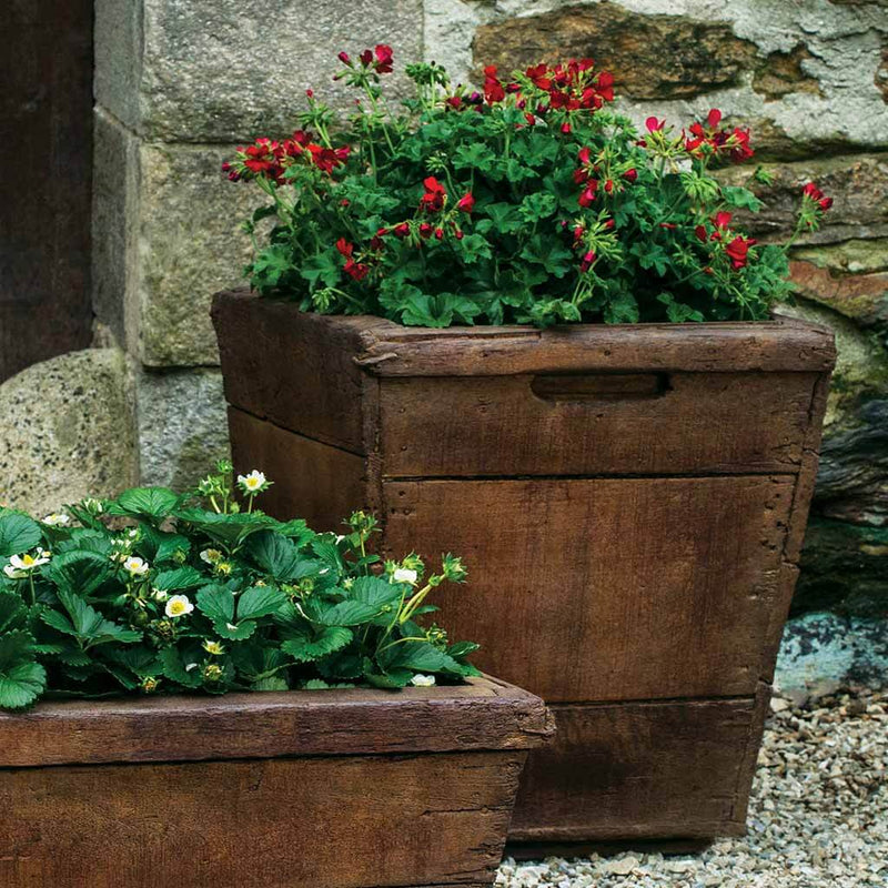 Campania International Medium Vendange Planter is shown in the Pietra Nuova Patina. Made from cast stone.