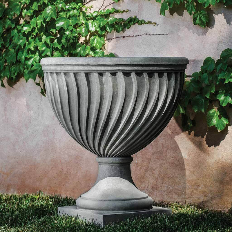 Campania International Quadrille Urn is shown in the Alpine Stone Patina. Made from cast stone.