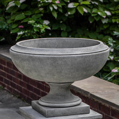 Campania International Jensen Small Urn is shown in the Alpine Stone Patina. Made from cast stone.