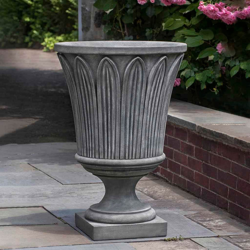 Campania International Las Palmas Urn is shown in the Alpine Stone Patina. Made from cast stone.