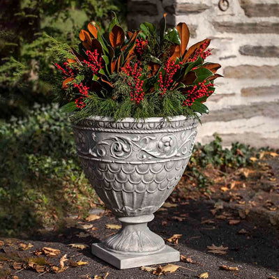 Campania International Valadier Urn is shown in the Alpine Stone Patina. Made from cast stone.