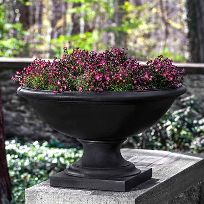Campania International Low Savannah Urn is shown in the Nero Nuovo Patina. Made from cast stone.