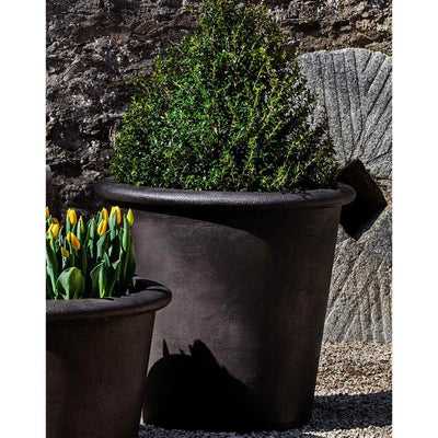 Campania International Palo Alto Tall Planter is shown in the Nero Nuovo Patina. Made from cast stone.