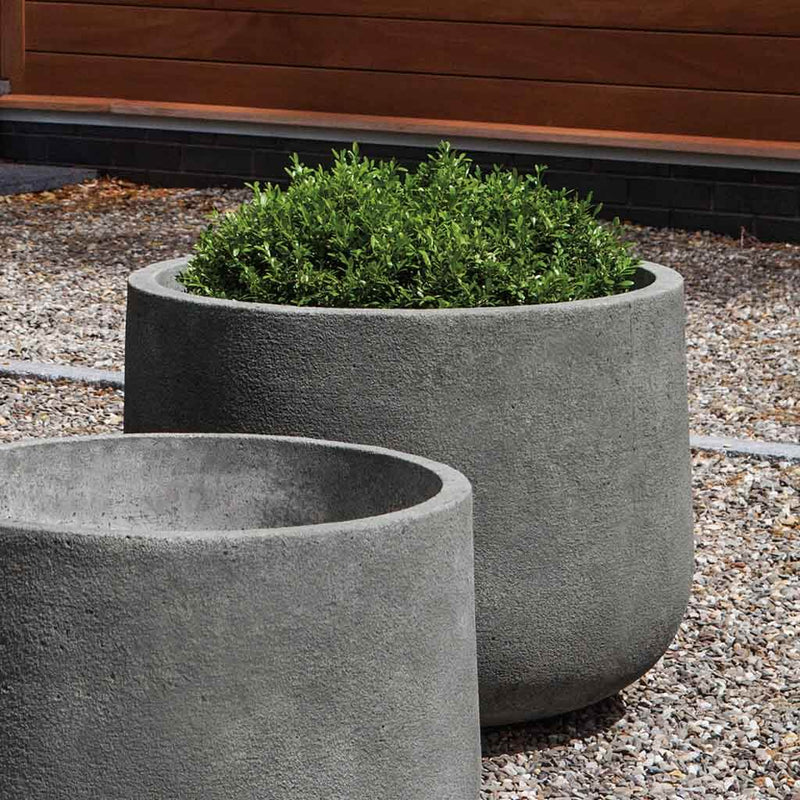 Campania International Tribeca Medium Planter is shown in the Greystone Patina. Made from cast stone.