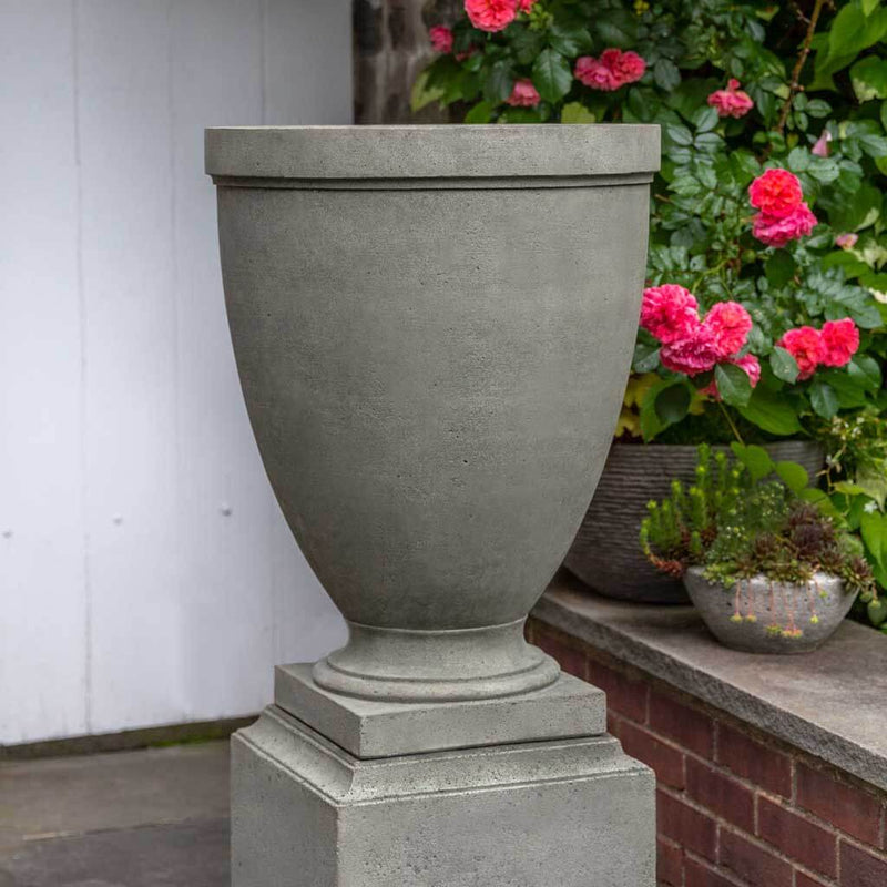 Campania International Capitol Hill Urn is shown in the Alpine Stone Patina. Made from cast stone.