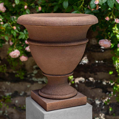Campania International St. James Small Urn, a classic fluted urn, ready for plants and shown in the Brownstone Patina. Made from cast stone.