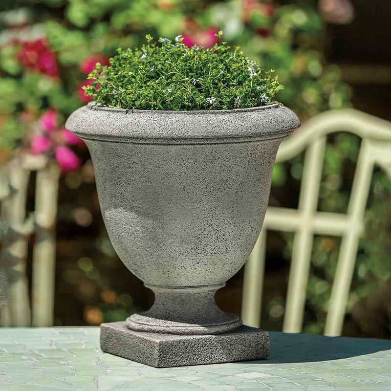 Campania International Oakdale Urn is shown in the Alpine Stone Patina. Made from cast stone.