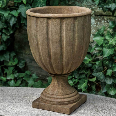 Campania International Kentfield Urn is shown in the Age Limestone Patina. Made from cast stone.