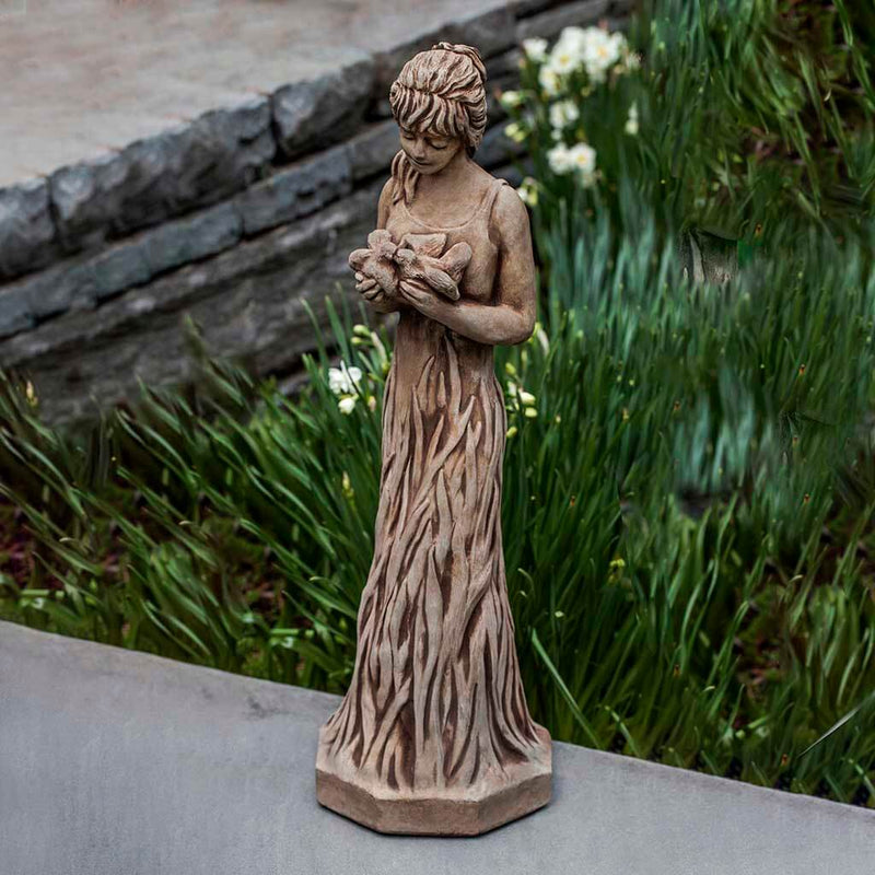 Campania International Fauna Statue, set in the garden to add charm and character. The statue is shown in the Brownstone Patina.
